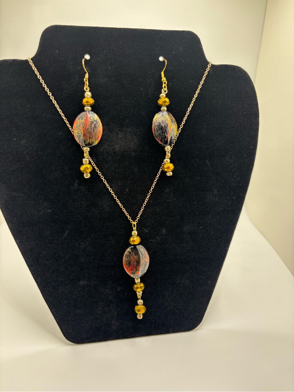 Hand Crafted Gold-Tone Necklace and Earrings with Orange and Black Marbled Beads